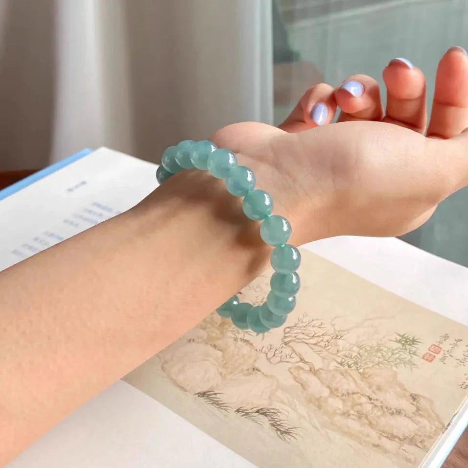 Natural Ice-glassy Jadeite 9.6mm Bead Bracelet with a Blue Base