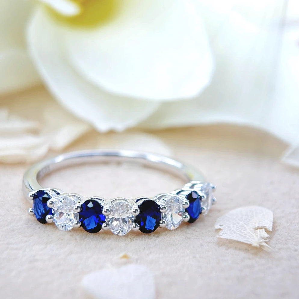 Royal Blue Sapphire and White Zircon Eternity Ring