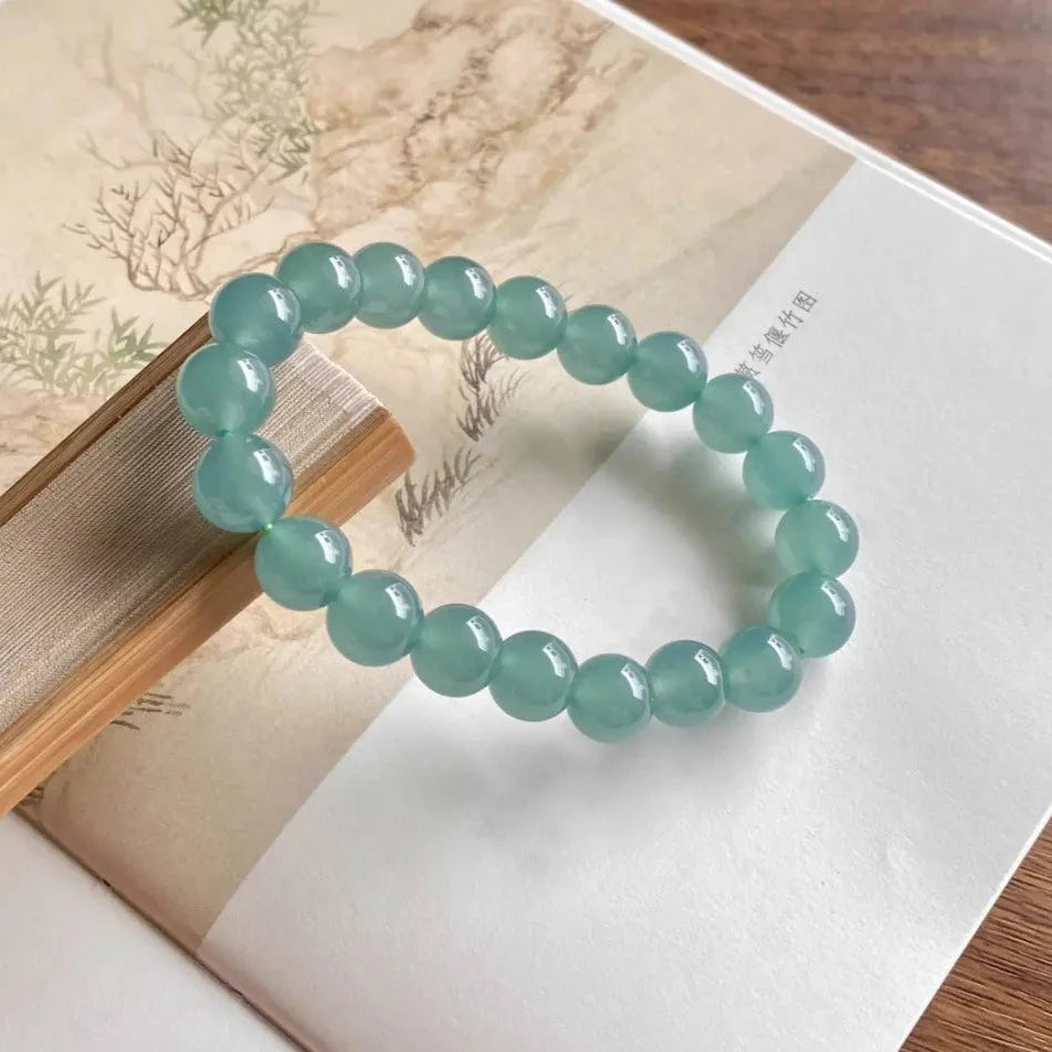 Natural Ice-glassy Jadeite 9.6mm Bead Bracelet with a Blue Base