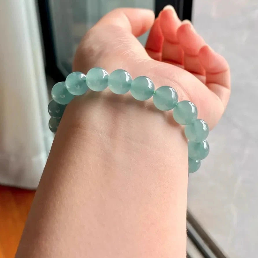 Natural Ice-glassy Jadeite 9.6mm Bead Bracelet with a Blue Base